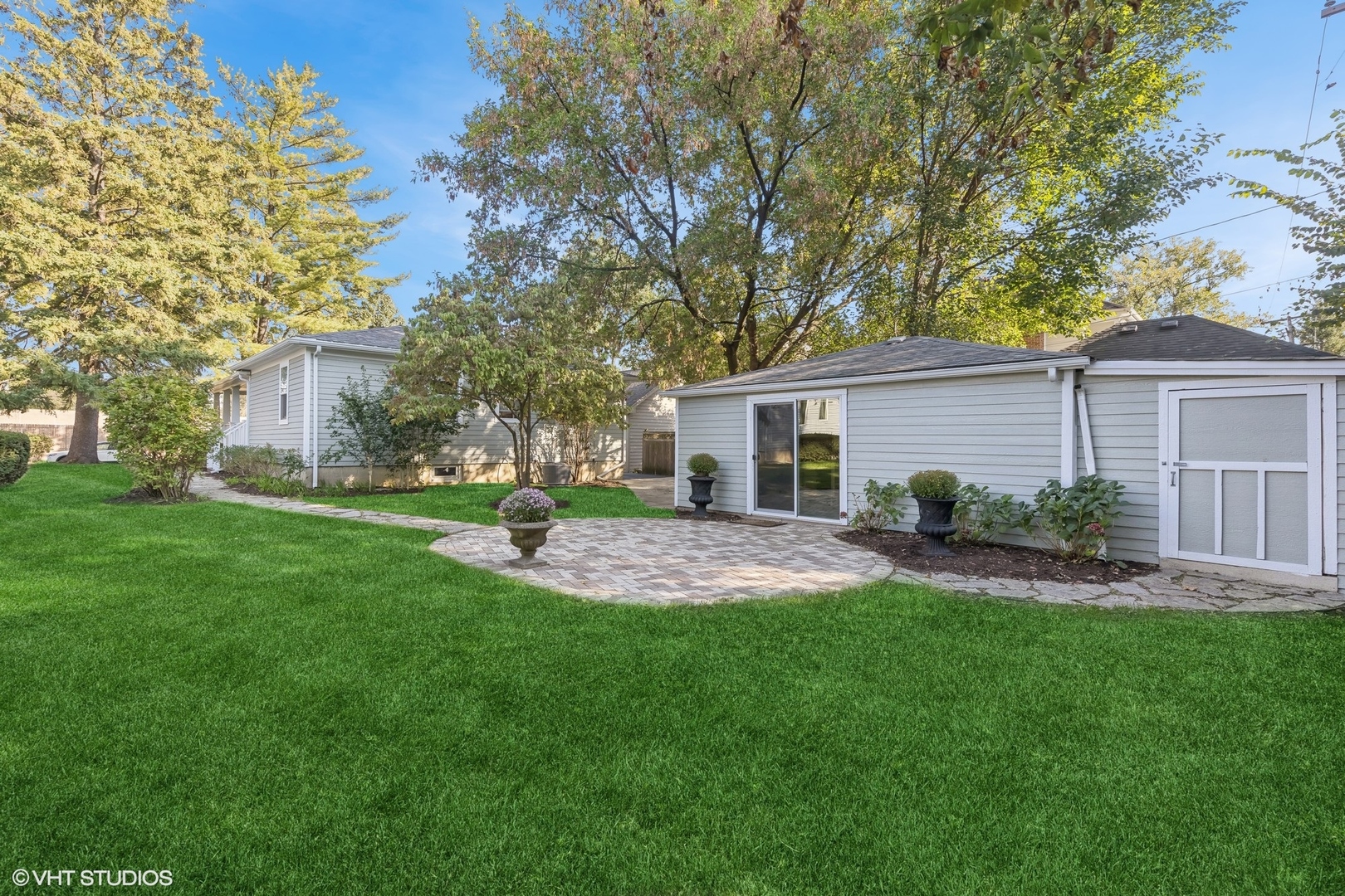 410 Mills Street Hinsdale, IL 60521 - Photo 17 of 22 a view of a house with a yard and green space