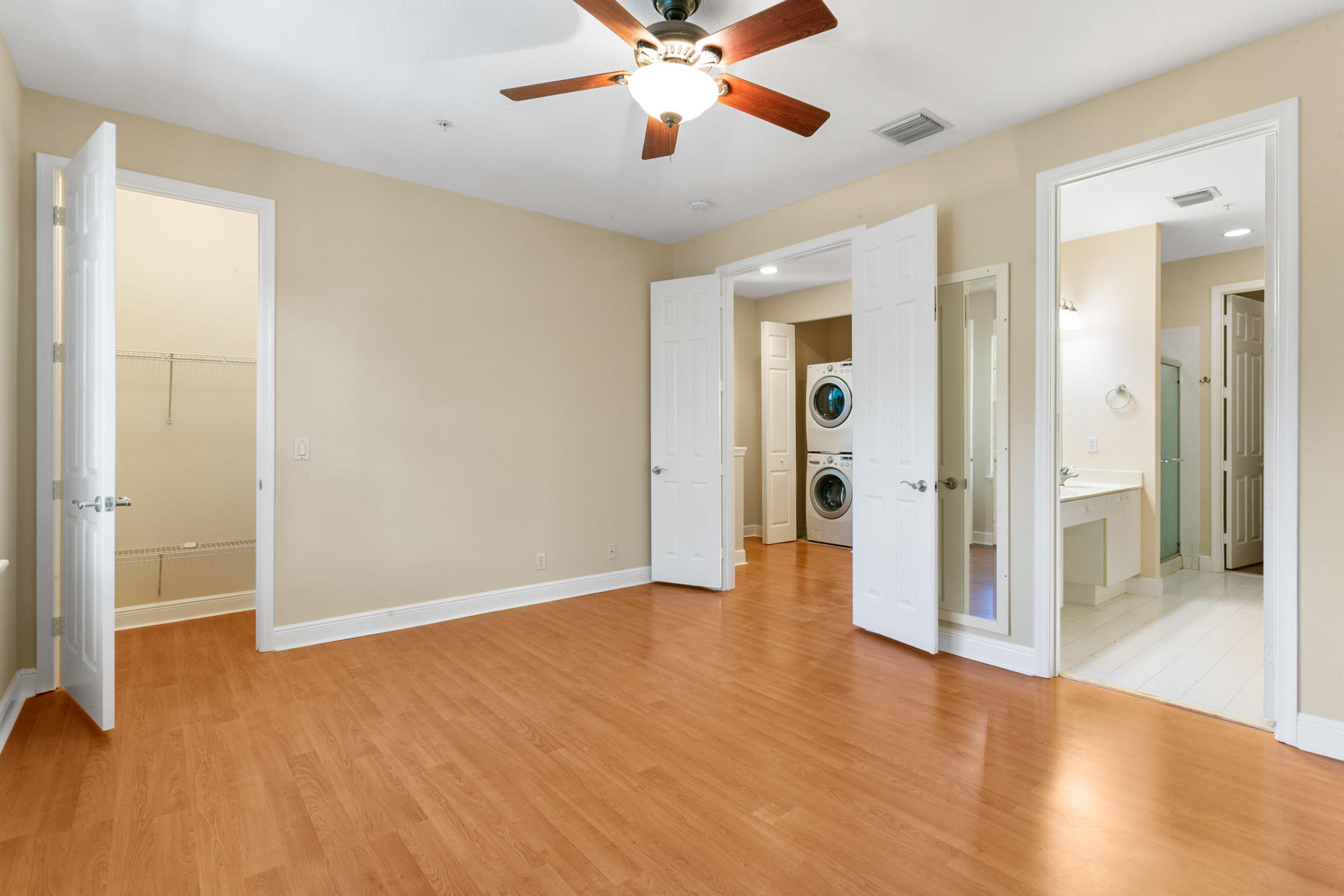 802 University Boulevard Jupiter, FL 33458 - Photo 11 of 16 wooden floor in an empty room with a window
