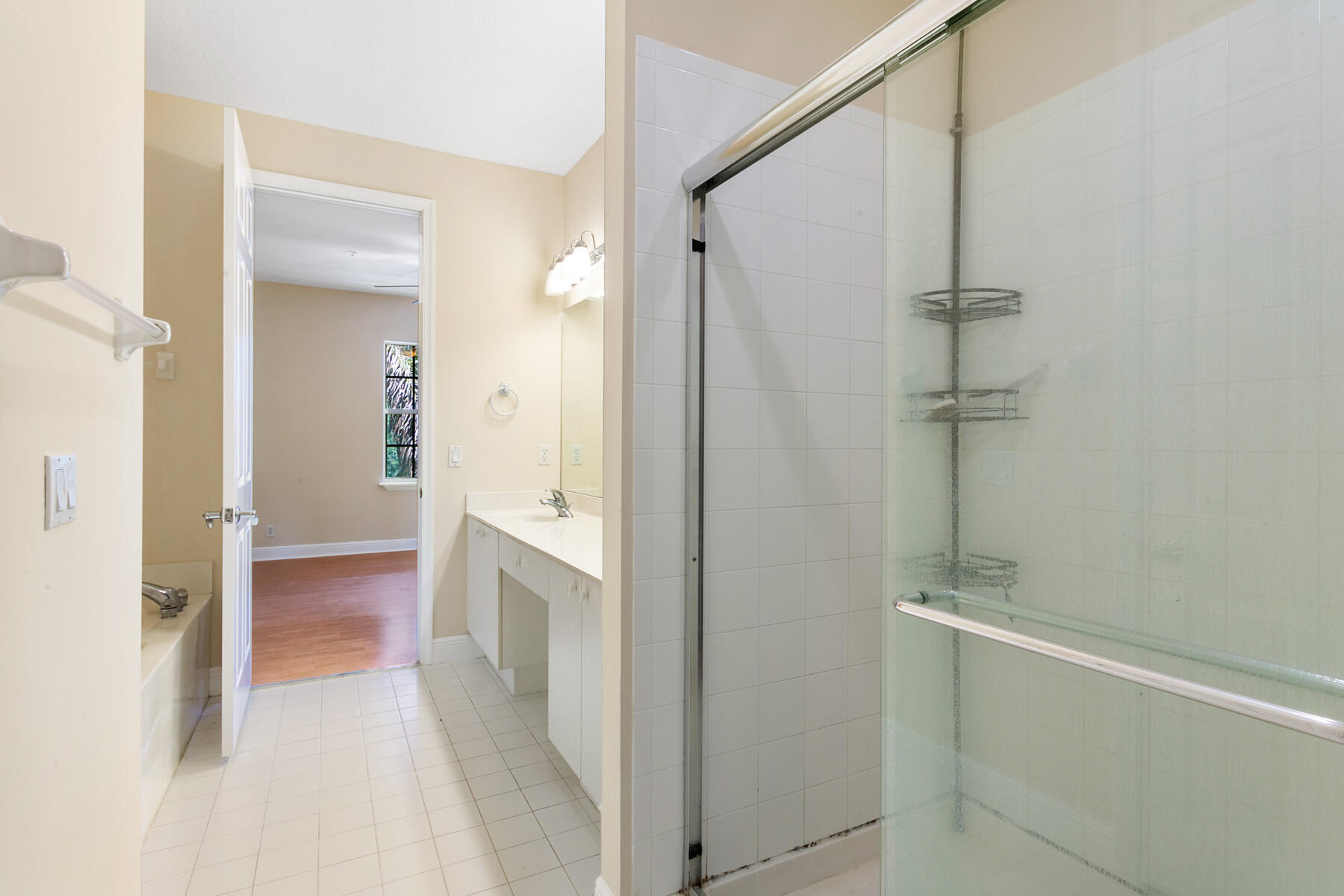 802 University Boulevard Jupiter, FL 33458 - Photo 14 of 16 a bathroom with a bathtub and a sink