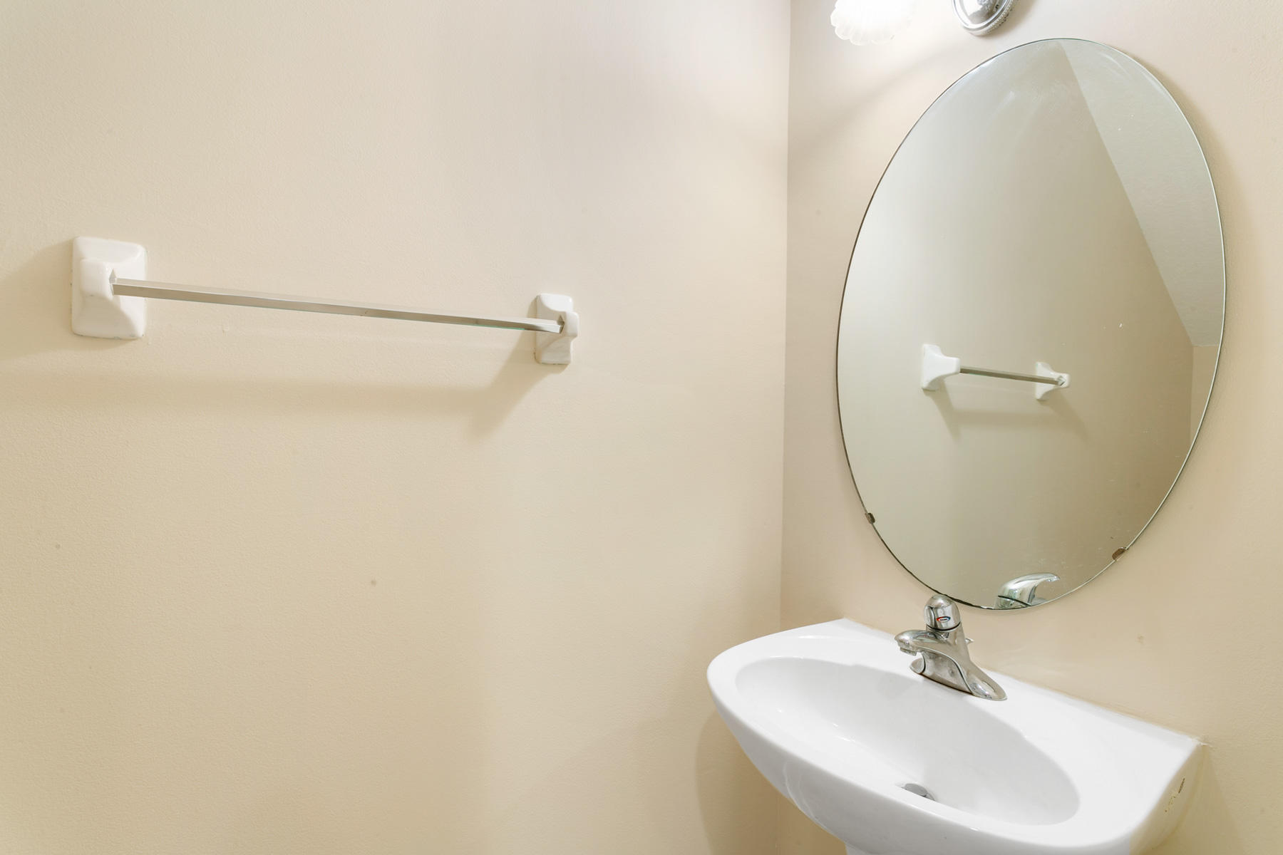 802 University Boulevard Jupiter, FL 33458 - Photo 16 of 16 a bathroom with a sink a mirror and a vanity