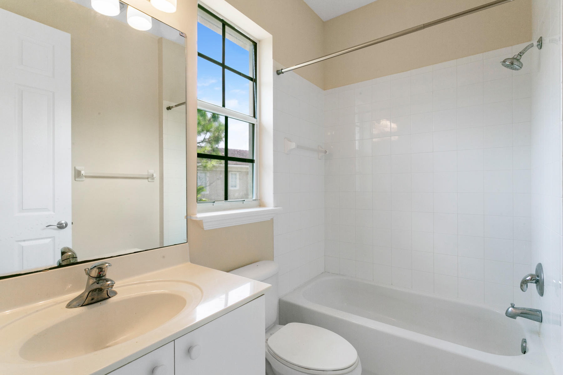 802 University Boulevard Jupiter, FL 33458 - Photo 9 of 16 a bathroom with a sink toilet and shower