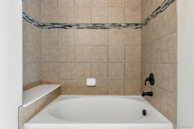 a bathroom with a granite countertop sink a mirror and a vanity