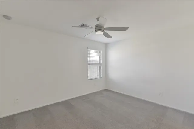 a bathroom with a bathtub shower sink vanity and toilet