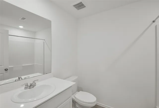 a utility room with a window and washer