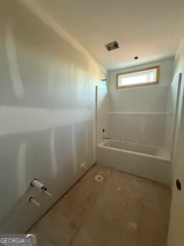 a picture of a bathroom with a window