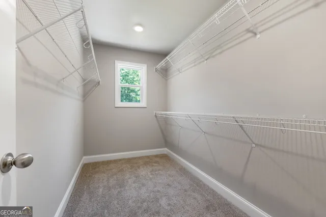 a bedroom with a bed and a flat screen television