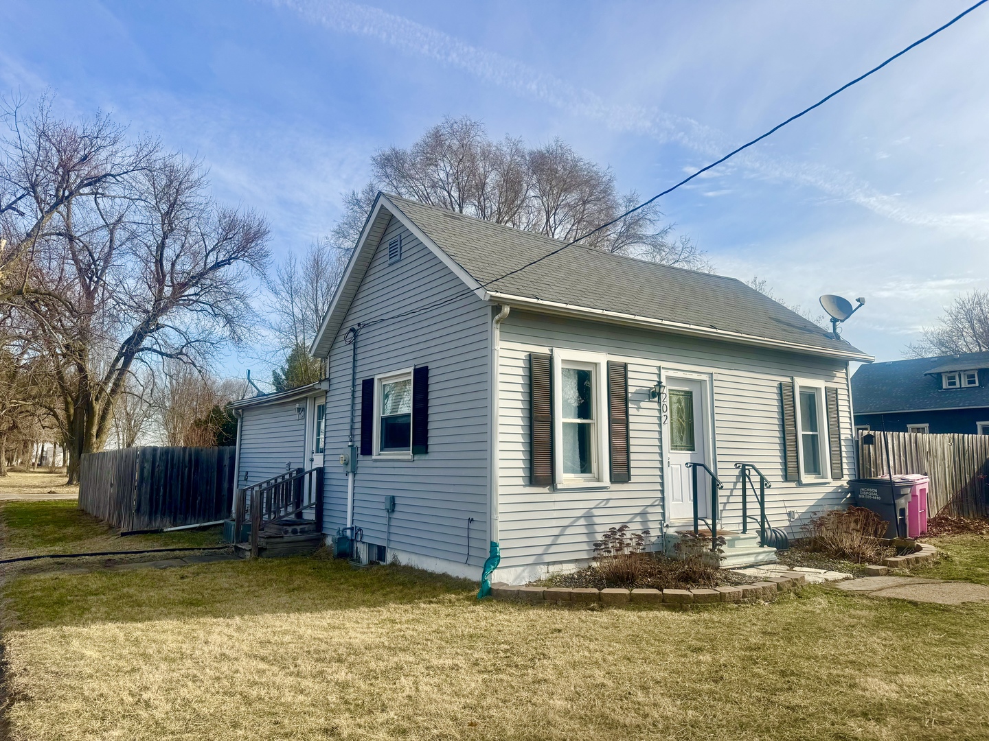 202 North Washington Street Joy, IL 61260 - Photo 1 of 12 a view of a house with a swimming pool