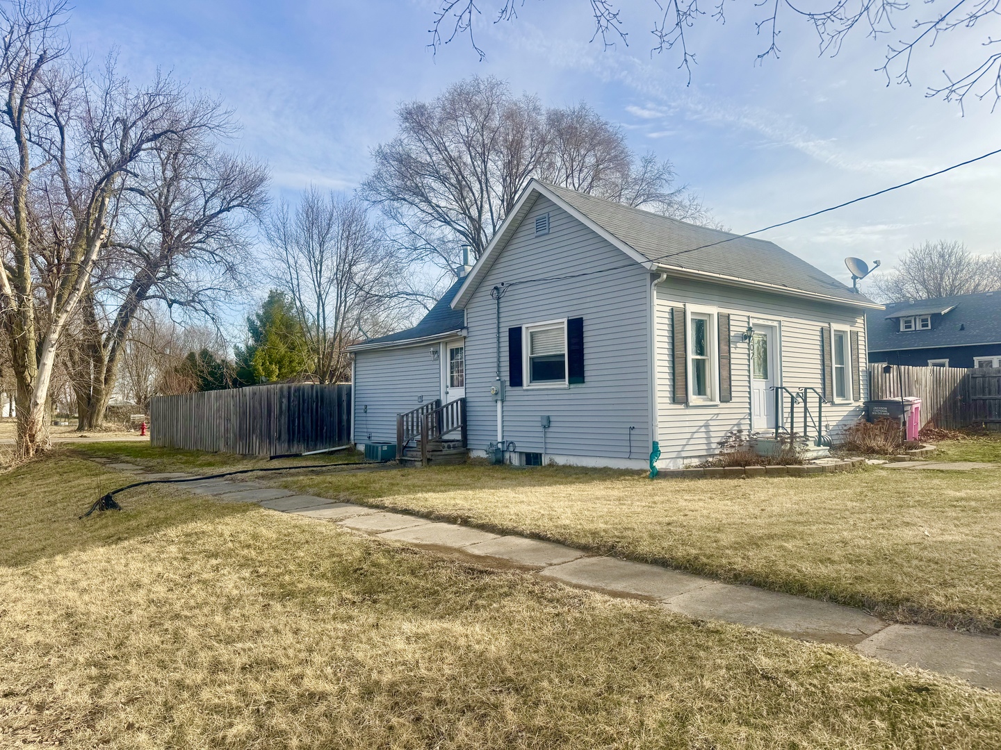 202 North Washington Street Joy, IL 61260 - Photo 2 of 12 a view of a yard in front of a house