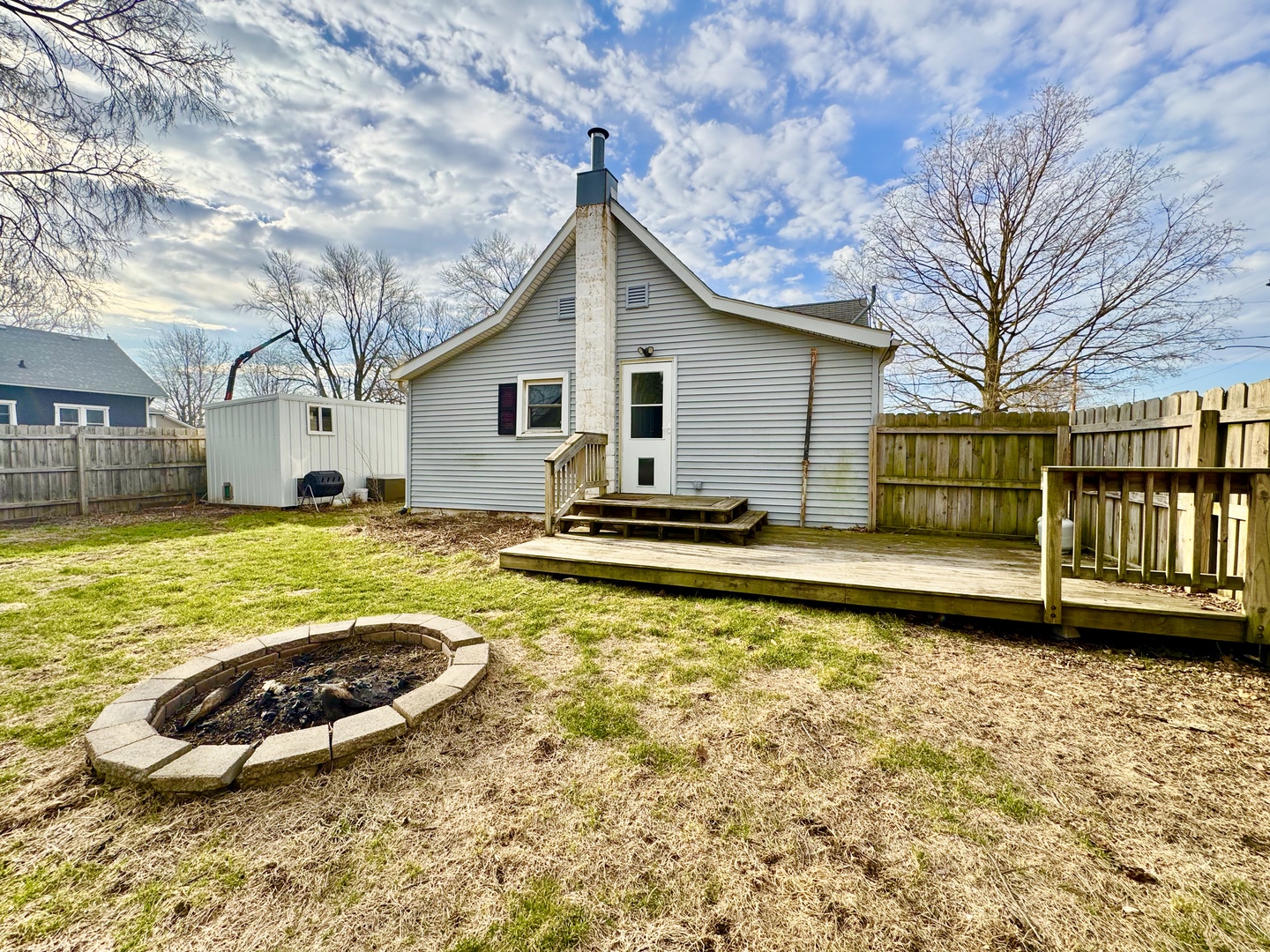 202 North Washington Street Joy, IL 61260 - Photo 3 of 12 a view of a house with swimming pool and a yard