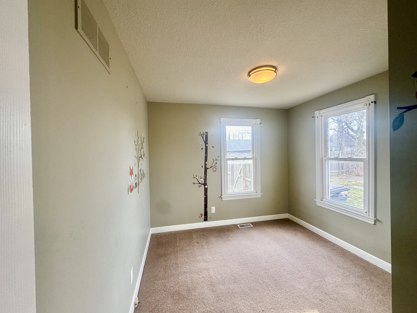 202 North Washington Street Joy, IL 61260 - Photo 9 of 12 an empty room with a window