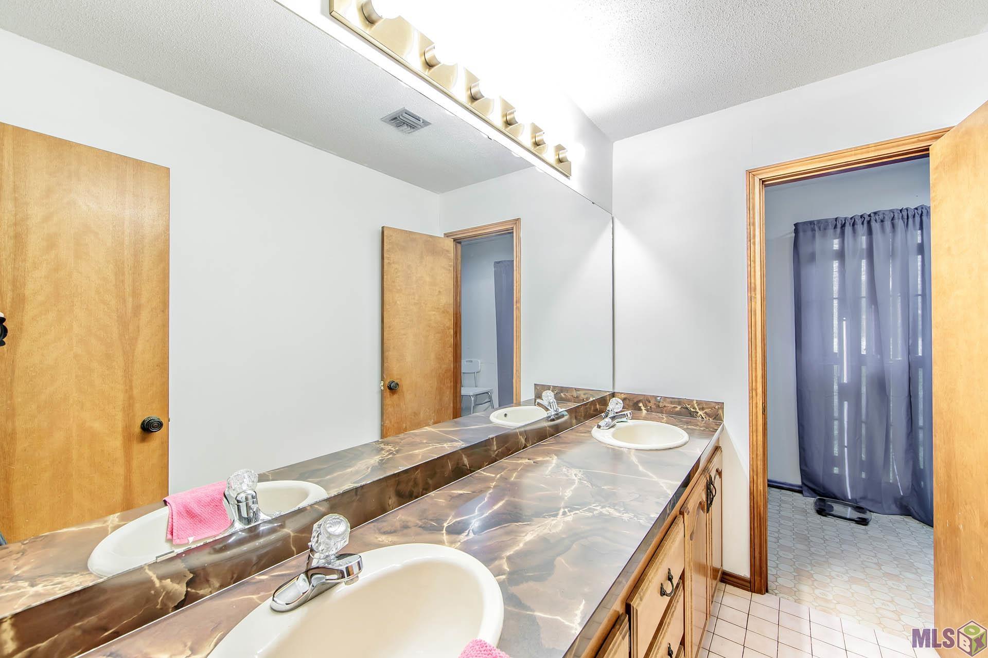 529 Pertuit Lane Raceland, LA 70394 - Photo 18 of 22 Bathroom 2