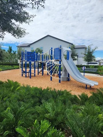 an aerial view of a house with swimming pool patio and outdoor seating