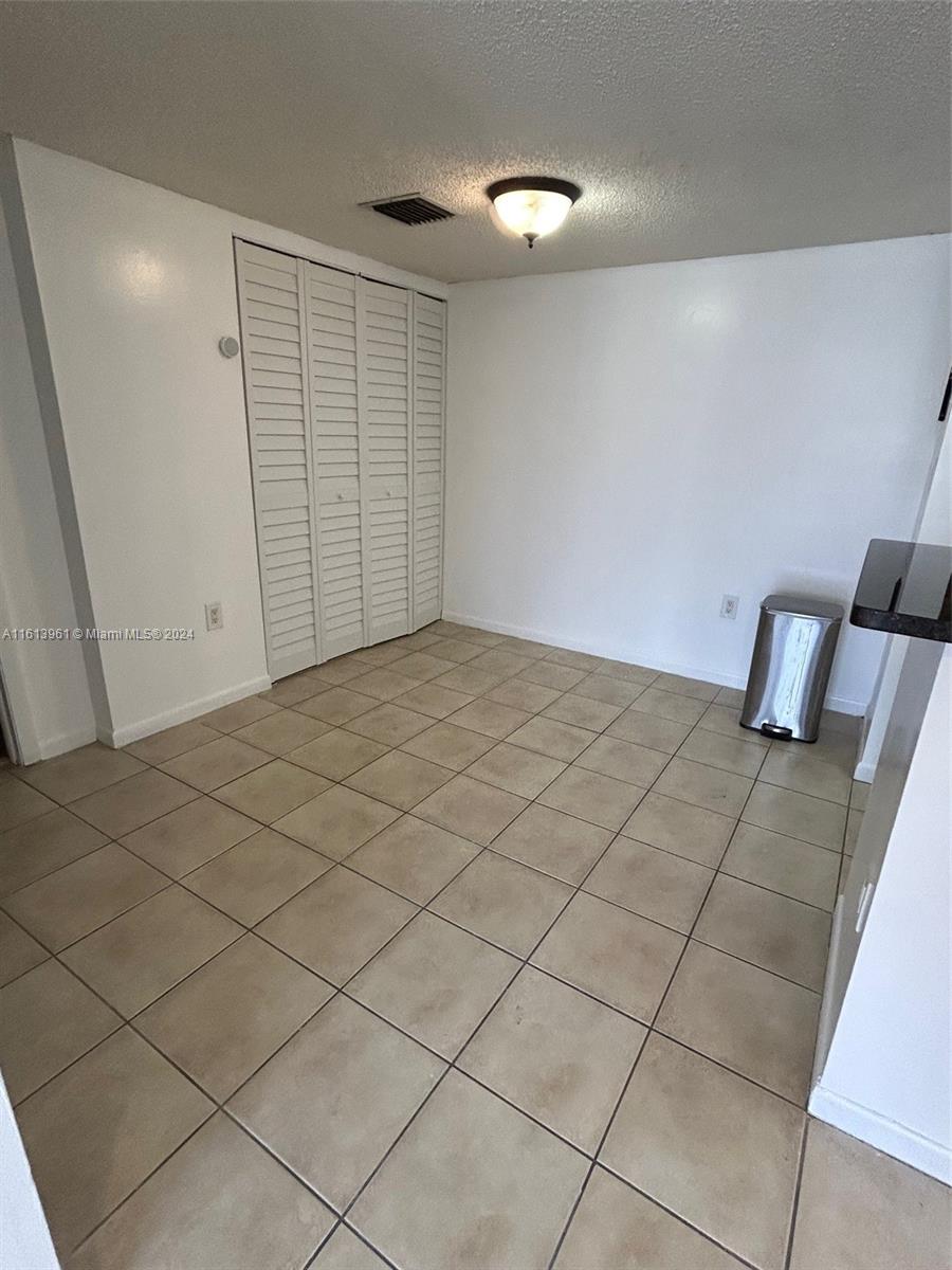 7130 Northwest 179th Street, Unit 303 Hialeah, FL 33015 - Photo 7 of 20 a view of empty room