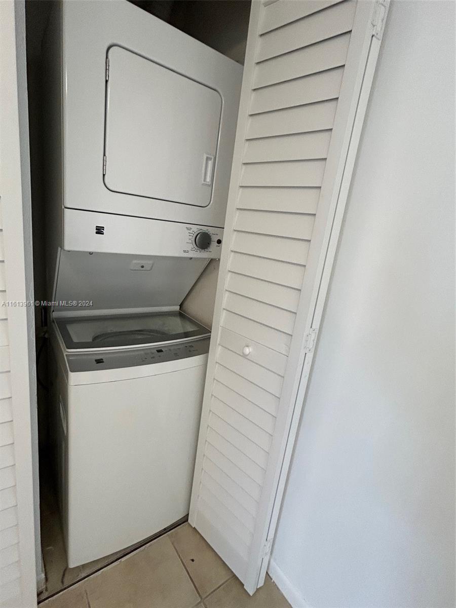 7130 Northwest 179th Street, Unit 303 Hialeah, FL 33015 - Photo 9 of 20 a utility room with dryer and washer