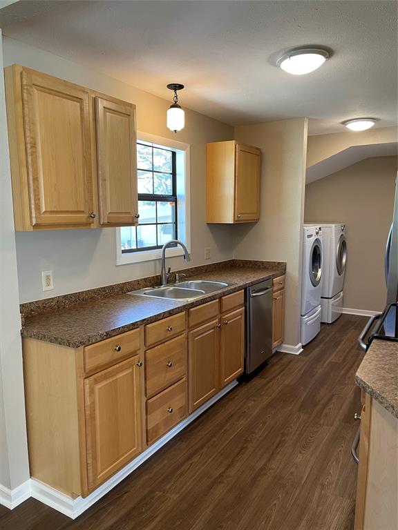 1509 Mitchell Drive Bonham, TX 75418 - Photo 3 of 9 a kitchen with sink cabinets and wooden floor