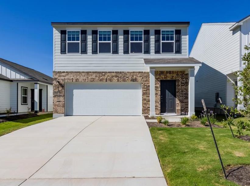 344 Enforcer Loop Jarrell, TX 76537 - Photo 1 of 34 a front view of a house with a yard and trees