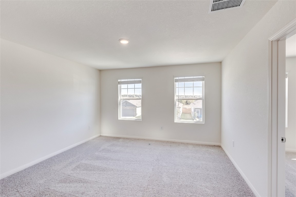 344 Enforcer Loop Jarrell, TX 76537 - Photo 18 of 34 an empty room with windows