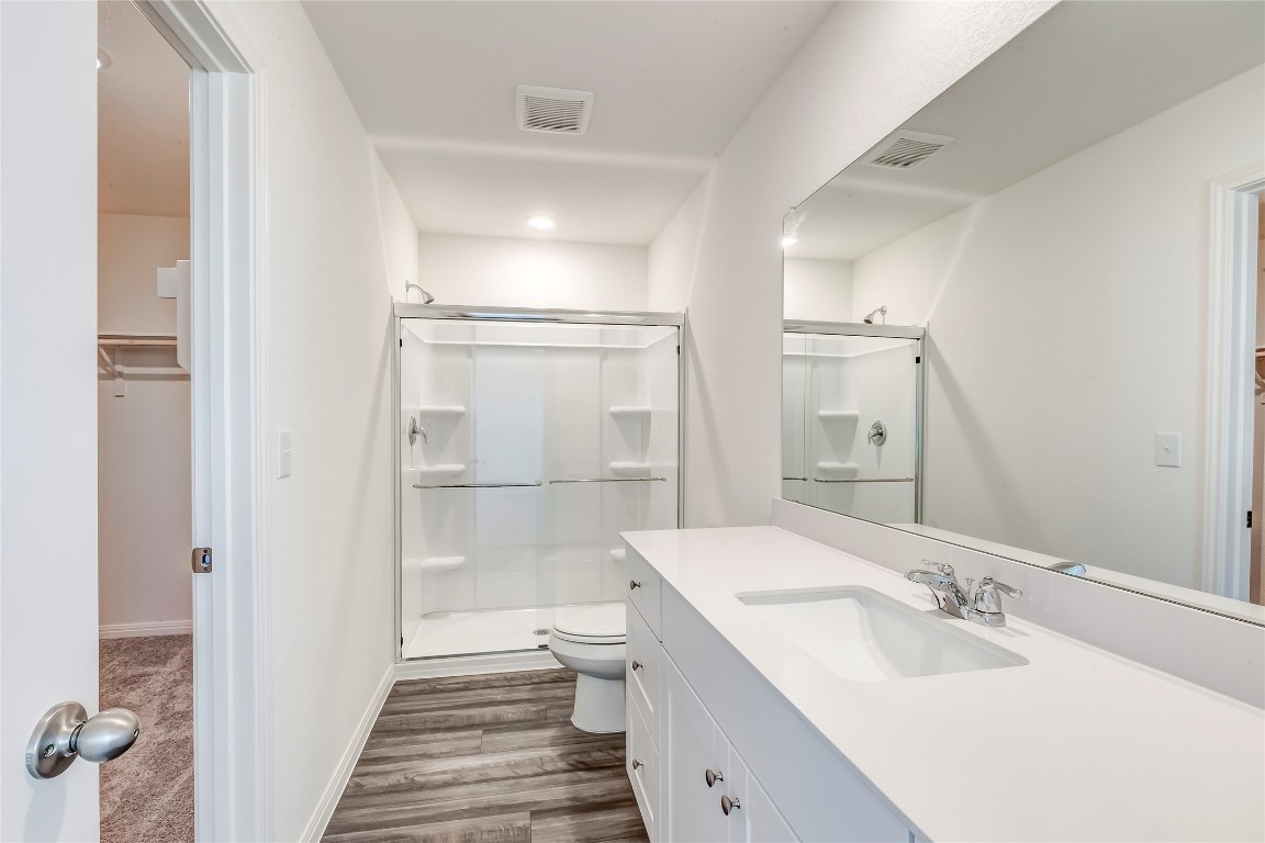 344 Enforcer Loop Jarrell, TX 76537 - Photo 24 of 34 a bathroom with a sink and a mirror