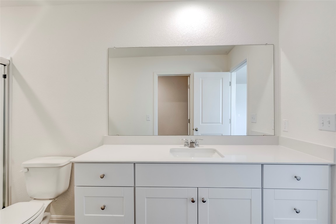 344 Enforcer Loop Jarrell, TX 76537 - Photo 25 of 34 a bathroom with a sink and a toilet