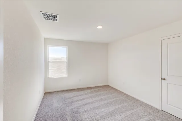 a bathroom with a bathtub shower sink vanity mirror and toilet