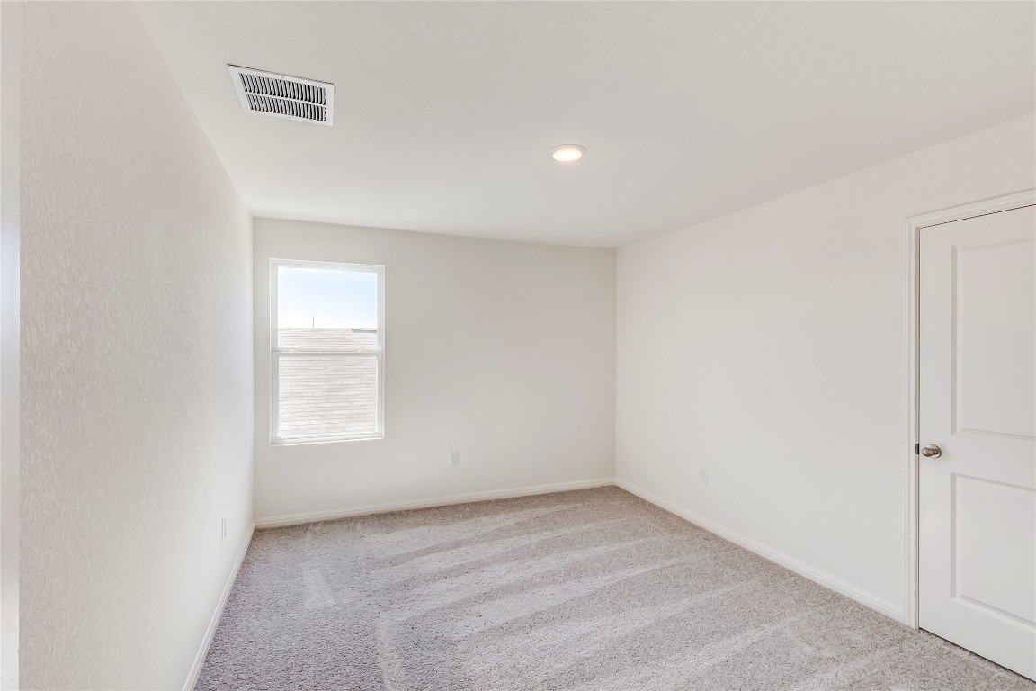 344 Enforcer Loop Jarrell, TX 76537 - Photo 26 of 34 an empty room with a window