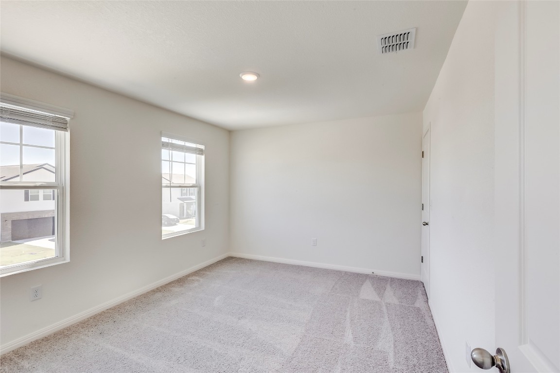 344 Enforcer Loop Jarrell, TX 76537 - Photo 28 of 34 an empty room with windows
