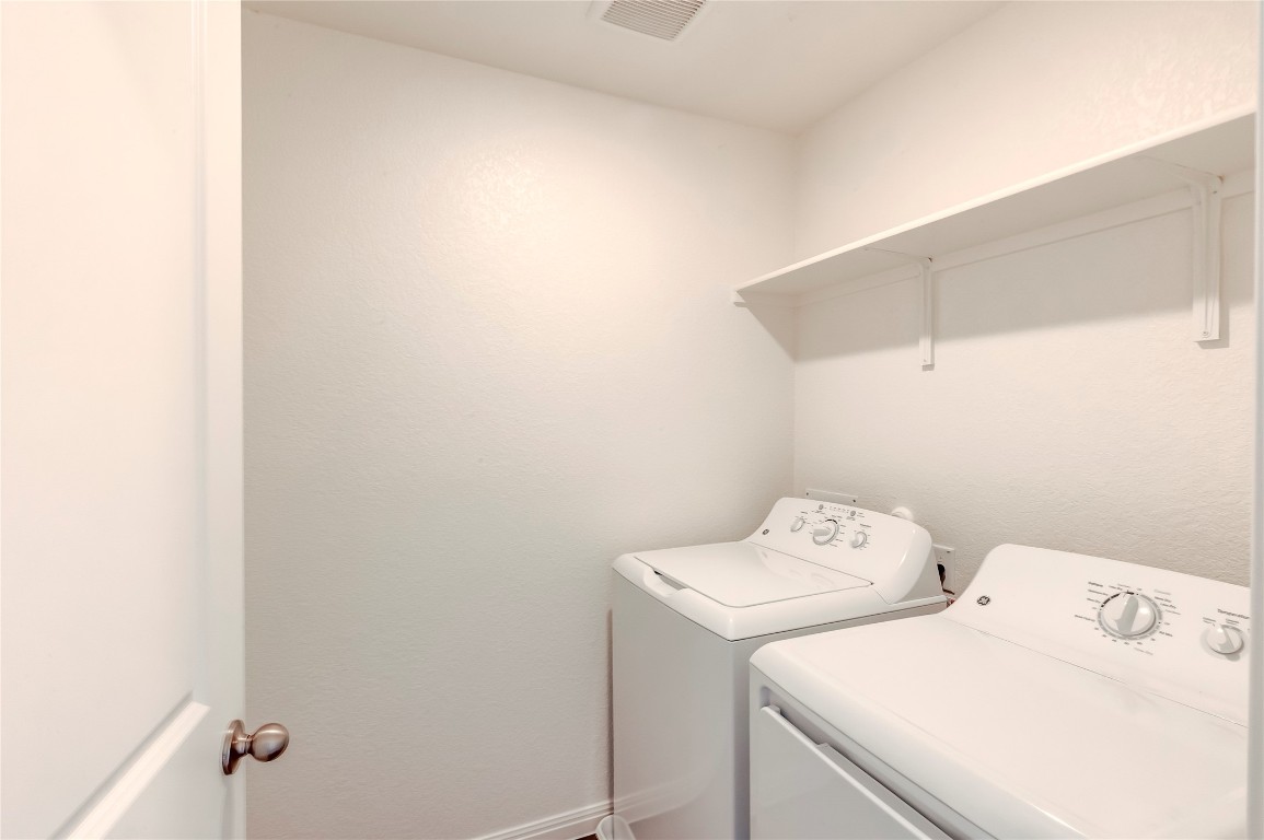 344 Enforcer Loop Jarrell, TX 76537 - Photo 29 of 34 a utility room with dryer and washer