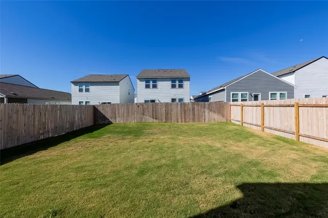 a view of a backyard with a garden