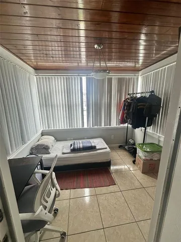 a bedroom with a bed and a walk in closet
