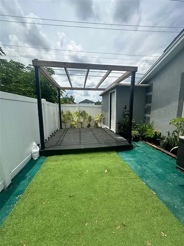 a view of an empty room with a fireplace