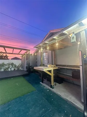 a view of yard from a backyard