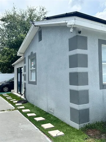 a view of a house with a yard and garage