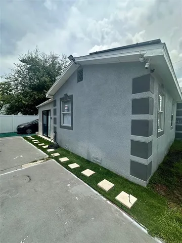 a house view with a backyard space