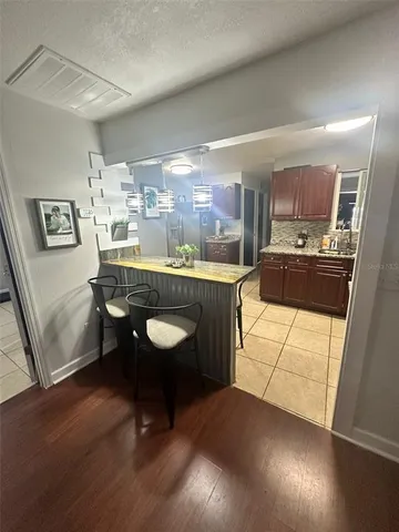 a kitchen with a sink appliances and cabinets