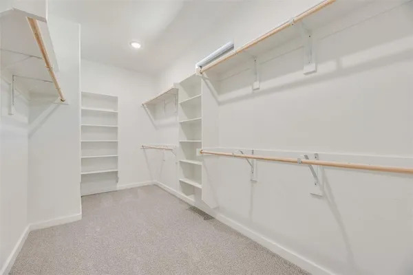 a view of an empty walk in closet