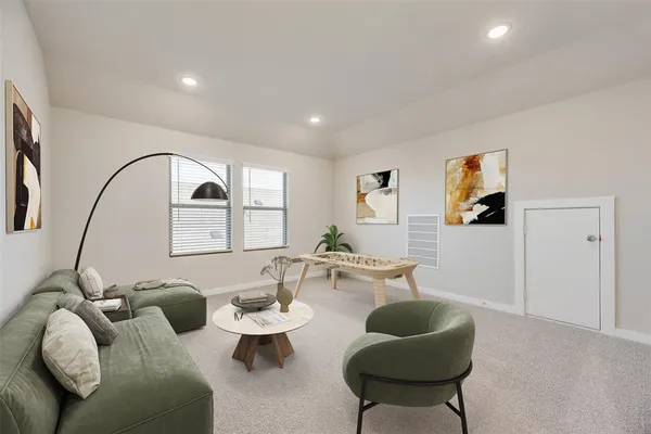 a living room with furniture a rug and a large window