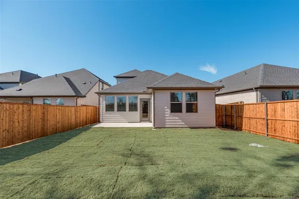 a view of a yard in front of a house with a yard