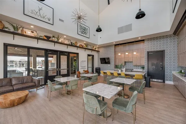 a outdoor space with lots of furniture and a chandelier