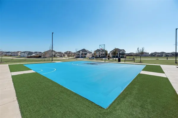 a view of a swimming pool with an outdoor space and seating area