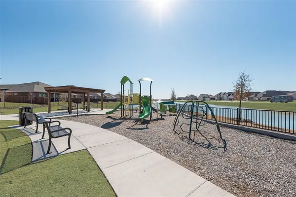 a view of a swimming pool with a lounge chair