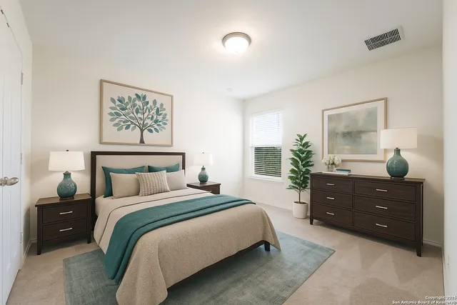 a bedroom with a bed and a dresser