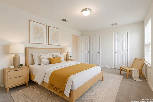 a bedroom with a bed and white couch