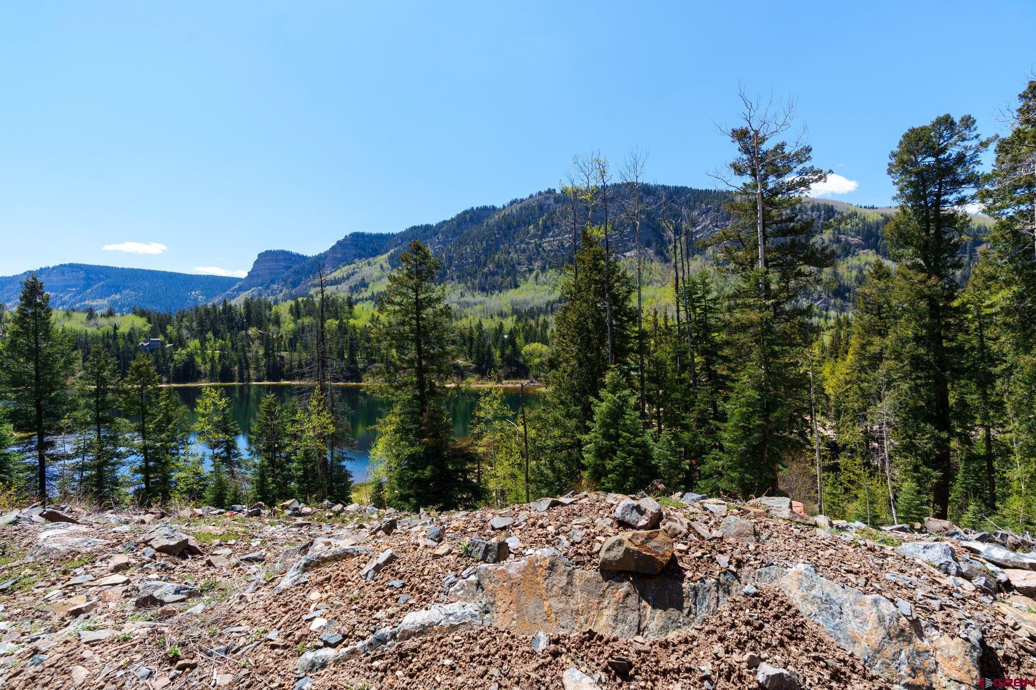 361 Deer Run Way Durango, CO 81301 - Photo 16 of 29 a view of a lake with a mountain in the background
