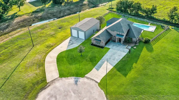 a view of a swimming pool with a yard