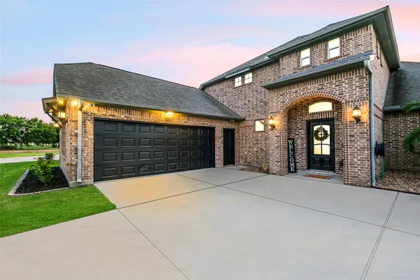 a view of living room filled with furniture and a potted plant