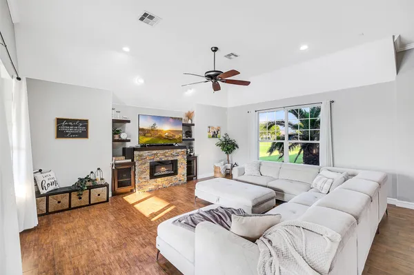 a living room with furniture and a window
