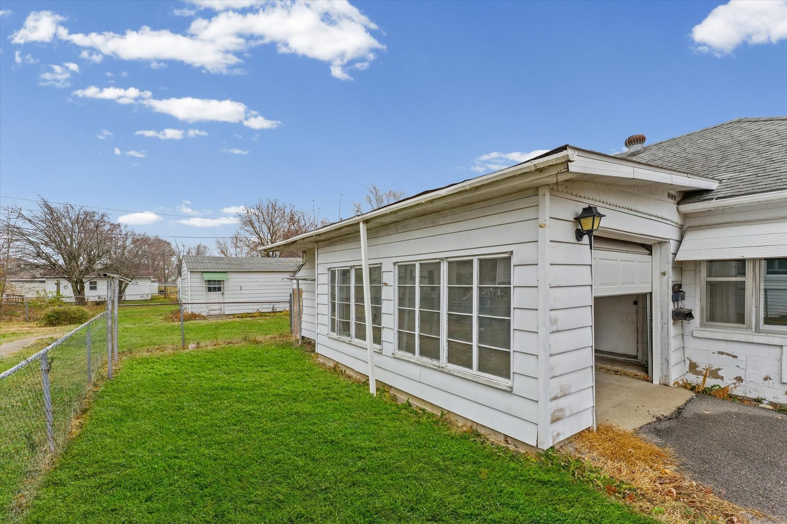 218 West Elm Street Hoopeston, IL 60942 - Photo 21 of 25 a front view of a house with a yard