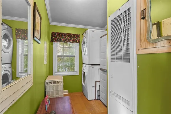 a very nice looking room with a large window and front door