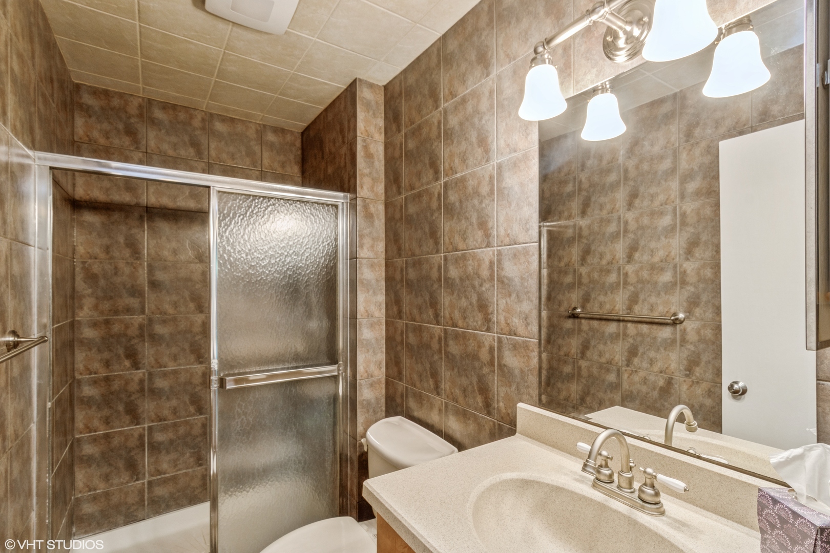 1926 Prairie Square, Unit 328 Schaumburg, IL 60173 - Photo 12 of 15 a bathroom with a sink toilet and shower