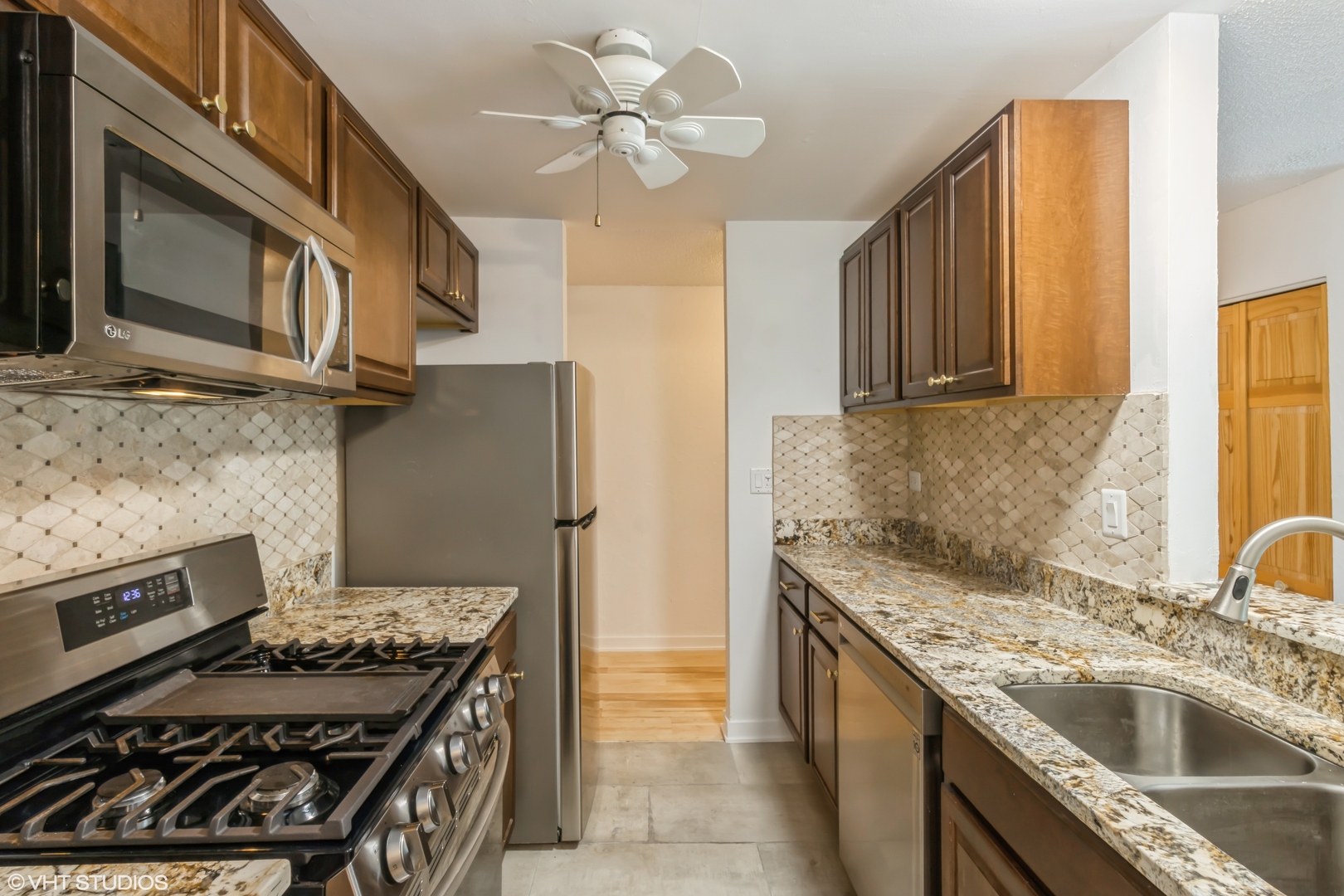 1926 Prairie Square, Unit 328 Schaumburg, IL 60173 - Photo 2 of 15 a kitchen with a stove and a sink